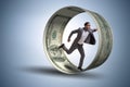 The businessman in hamster wheel chasing dollars Royalty Free Stock Photo