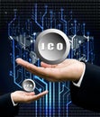 Businessman hand carry ICO symbol with digital circuit tree back Royalty Free Stock Photo