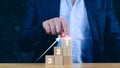 Businessman hand choose the wooden block with number 1 sign and up arrow, Concept of success ,winner, victory or top ranking