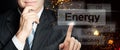 Businessman hand chooses Energy. World Energy concept