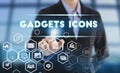Businessman hand chooses Gadgets icons wording on interface
