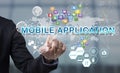 Businessman hand chooses Mobile application wording on interface Royalty Free Stock Photo