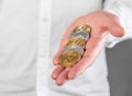 Businessman hand closeup holding cryptocurrency. Bitcoin, ethereum, litecoin. Mining and blockchain technology concept