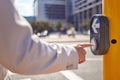 Businessman, hand and crosswalk button for safety, travel and walking to workplace in city. Male person, robot and Royalty Free Stock Photo