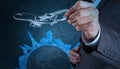 Businessman hand draws airplane travel around the world Royalty Free Stock Photo