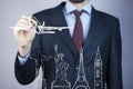 Businessman hand draws the airplane travel around the world Royalty Free Stock Photo