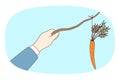 Businessman hand hold carrot on stick