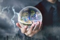 Businessman hand hold crystal ball with city night inside Royalty Free Stock Photo