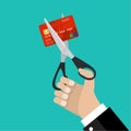 Businessman hand hold scissors cutting credit card