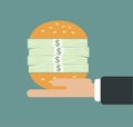 Businessman hand hold stack of money in burger monetary