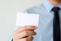 Businessman hand holding blank white business card with copy spa Royalty Free Stock Photo