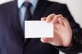 Businessman hand holding blank white business card with copy spa Royalty Free Stock Photo