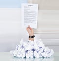 Businessman hand holding contract paper