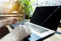 Businessman hand holding credit card using laptop computer typing keyboard Royalty Free Stock Photo