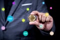 Businessman hand holding crytocurrency bitcoin connect with many