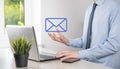 Businessman hand holding e-mail icon, Contact us by newsletter email and protect your personal information from spam mail. Royalty Free Stock Photo