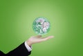 Businessman hand holding green globe. Element of this image are furnished by NASA Royalty Free Stock Photo
