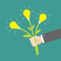 Businessman hand holding idea light bulb flowers. Flat design. Royalty Free Stock Photo