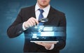 Businessman hand holding magnifier over tablet pc Royalty Free Stock Photo
