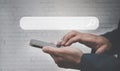 Businessman hand holding the mobile screen, Mockup cell mobile smartphone in a suit holds a mobile phone with blank white screen Royalty Free Stock Photo