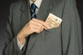 Businessman hand holding money, euro bills. Banknotes isolated gray background. Royalty Free Stock Photo