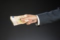 Businessman hand holding money. Fifty euros Royalty Free Stock Photo