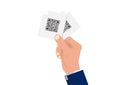 Businessman`s hand holding paper with qr code