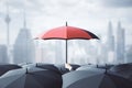 Businessman hand holding red umbrella over crowd on dull city background. Risk, protection and safety concept