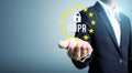 Businessman hand holding sign general data protection regulation GDPR and key icon Royalty Free Stock Photo