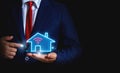 Businessman hand holding smart housing icon Royalty Free Stock Photo