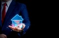 Businessman hand holding smart housing icon Royalty Free Stock Photo