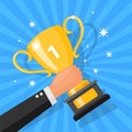 Businessman hand holding trophy. Winner trophy award design Royalty Free Stock Photo