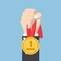 Businessman hand holding winner medal Royalty Free Stock Photo