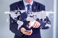 Businessman hand phone with world map on screen Royalty Free Stock Photo