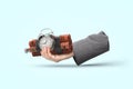 Businessman hand with pile of dynamite an detonator