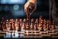 Businessman hand playing chess pieces on board Royalty Free Stock Photo