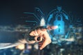 Businessman hand pointing at abstract glowing blue padlock hologram on blurry night city background. Internet, information, Royalty Free Stock Photo