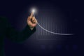 Businessman hand pointing finger to growth success finance business chart,graph investment diagram on analysis stock Royalty Free Stock Photo