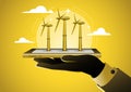 Businessman hand present wind turbine power generator Royalty Free Stock Photo