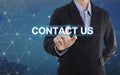 Businessman hand pressing button contact us. Royalty Free Stock Photo