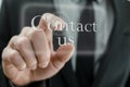 Businessman hand pressing Contact us button on touch screen Royalty Free Stock Photo