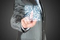 Businessman with hand pressing virtual qr code Royalty Free Stock Photo