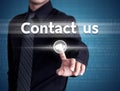 Businessman hand pushing contact us button on a touch screen interface Royalty Free Stock Photo