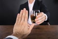 Businessman Hand Rejecting A Glass Of Whiskey Royalty Free Stock Photo