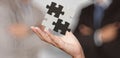 Businessman hand showing 3d puzzle partnership sign