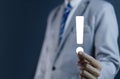 businessman hand showing exclamation point business development ideas Warning of errors, dangers, alerts, maintenance, And finding Royalty Free Stock Photo