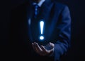 businessman hand showing exclamation point business development ideas Warning of errors, dangers, alerts, maintenance, And finding Royalty Free Stock Photo
