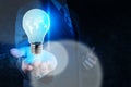 Businessman hand showing light bulb with social network Royalty Free Stock Photo