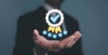 Businessman Hand shows the sign of the top service the best Quality assurance, Guarantee, Standards, ISO certification and