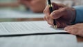 Businessman hand signing agreement negotiation table. Happy employee satisfied Royalty Free Stock Photo